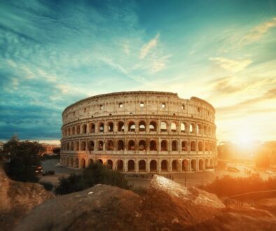 Beautiful shot of the famous Roman Colosseum amphitheater under the breathtaking sky at sunrise